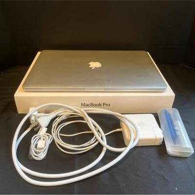 15” MacBook Pro And Accessories (turns On)