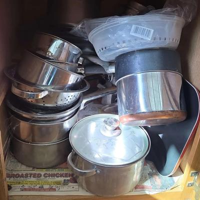 Cupboard of Kitchen Cookware - Pots & Pans & Casserole Dishes