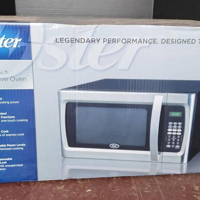 NEW Oster 1.3 Cu.Ft. Microwave Oven - 1100 Watts, 6 Cooking Functions, Express Cook, In Box