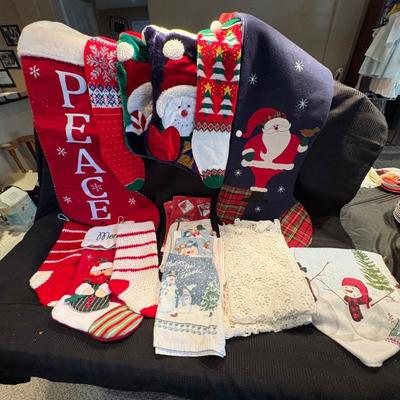 H assortment of christmas stockings towels,