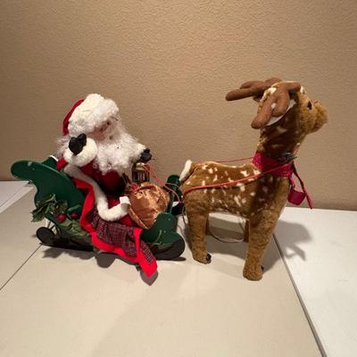 H santa s best animated reindeer pulling santa's sleigh