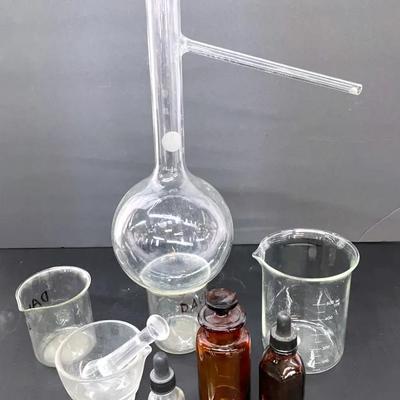 Pyrex Distillation Flask with Motar And Pestle, Beakers And Bottles