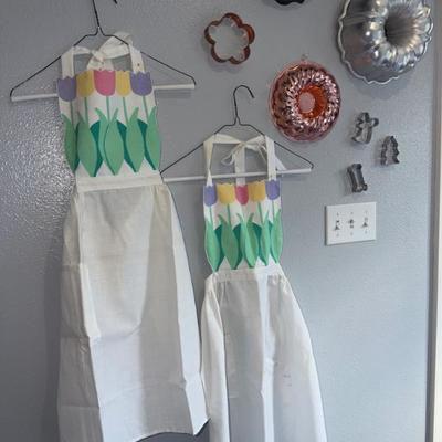 APRONS/ COOKIE CUTTERS