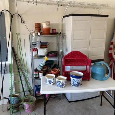 Metal and Plastic Shelving Units with Gardening Supplies