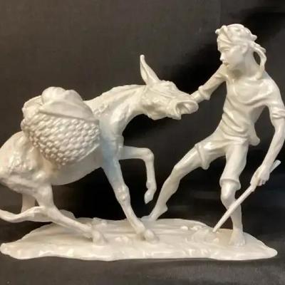 Alboth & Kaiser porcelain figurine titled "Boy with Mule." 
