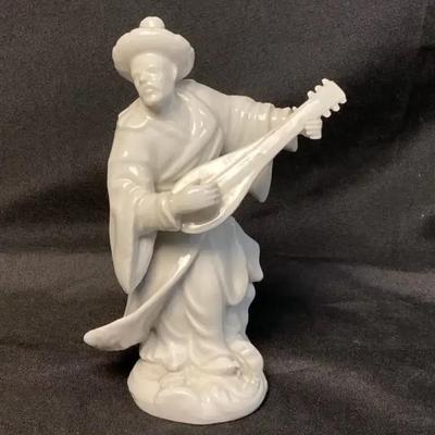 Continental Blanc de Chine White Porcelain Figure of a Musician