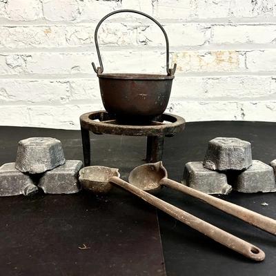 Lead Melting Pot And Frame With Lead Ingots And Scrap