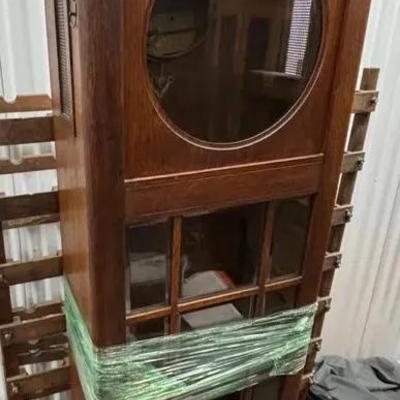 Tall Wooden Clock Case with Glass Panels and Clock Face