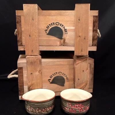 2 Bastogne Airborne wooden packs with a helmet “ Battle of the Bulge” mugs