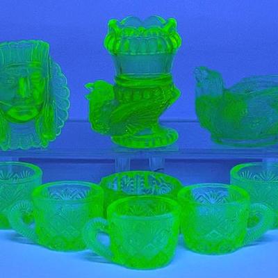 Sale Photo Thumbnail #653: 9 Figural Uranium Glass Salt Cellars (Boyd)