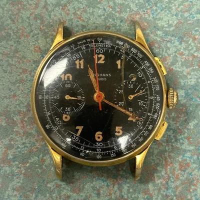 vintage Junghans Meister Telemeter chronograph wristwatch with a black dial and gold-plated case