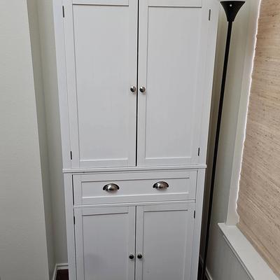White Cabinet And Black Lamp