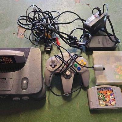 Sale Photo Thumbnail #158: 6120 • vintage nintendo 64 with controler & games