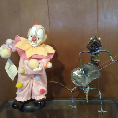 Clown doll and handmade lizard playing guitar from upcycled aluminum
