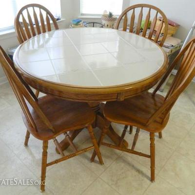 Round Oak tile top table and chairs
