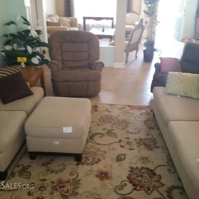 large rug, couch, loveseat, reclining chairs