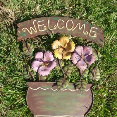 metal hanging welcome sign