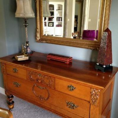 Late 1800's Oak server with detailed carving and large beveled mirror