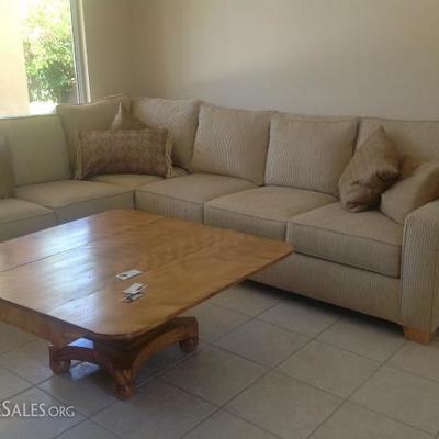 Tan sectional with solid wood coffee table over 50 years old