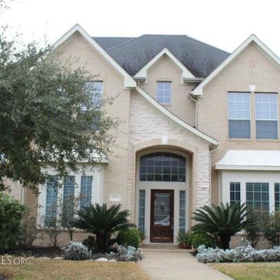 Two-story Grand Lakes home in Katy, Texas featuring 5 bedrooms, 3 Â½ bath, formal dining room, study, and beautifully lan