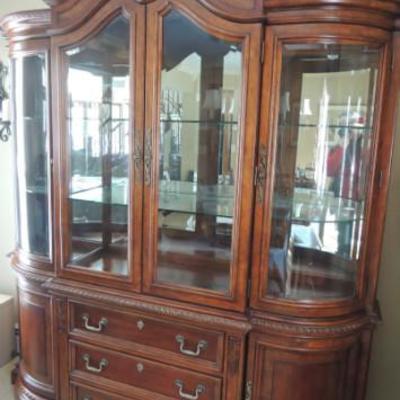 Wynwood china closet from dining room set, lighted, with silver drawer and mirrored nack.