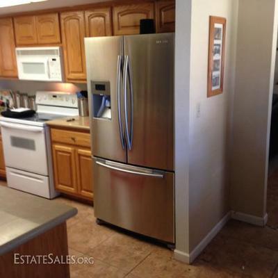 Smooth top electric stove and stainless fridge