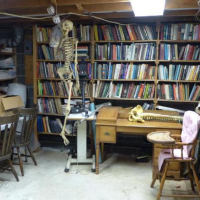 Real human skeleton, medical books