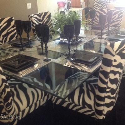 Glass table and 8 zebra print chairs