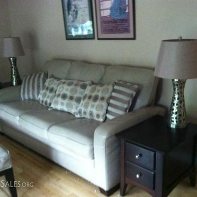 Raymour and Flanigan leather sofa with coordinating end tables and lamps.