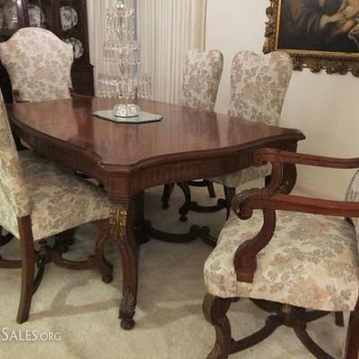 Late 19th to early 20th century Italian carved mahogany & parcel gilt dining table & chairs