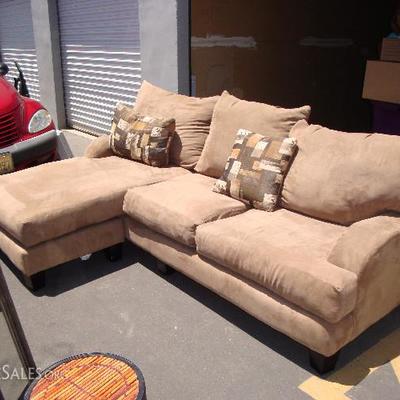Sofa tan microfiber/faux suede.  Similar designs retail for $719 at Jeromes.