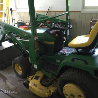 John Deere Tractor model 445 - with loader, snow plow, mower, trailer and more