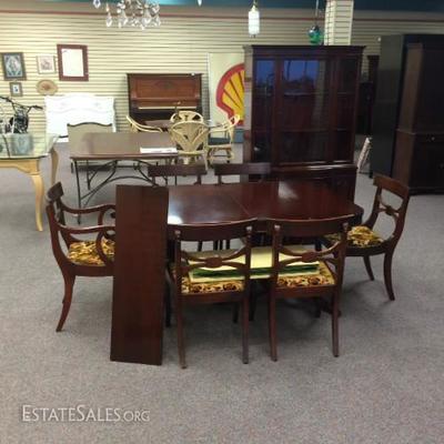 A great dining room table, chairs, and hutch.