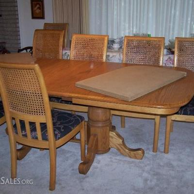Dining Room table and chairs, with table pads.