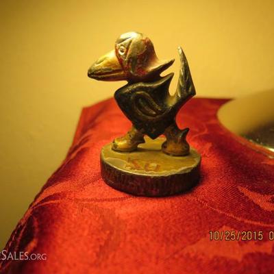 This is a 1929 lead University of Kansas Jayhawk mascot paperweight. This is a vintage piece. Approx. 2.5