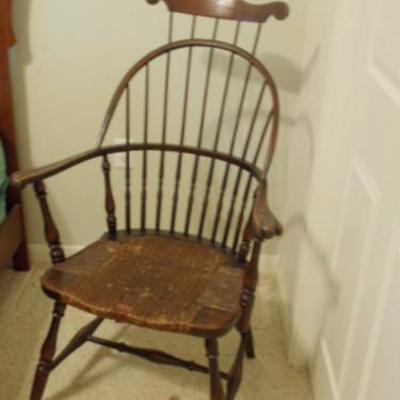 antique Windsor chair with headrest and rush seat.