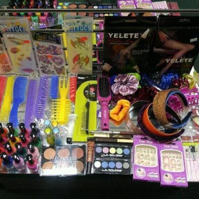 Lot of assorted nail polish, combs, head bands, make up, cosmetic brushes and hair accessories. Also