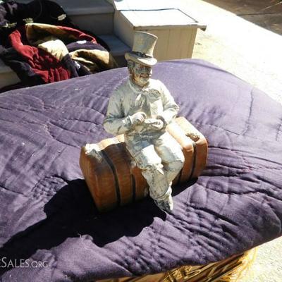 Rare 19th century painted metal doorstop:Man seated on Cotton bale