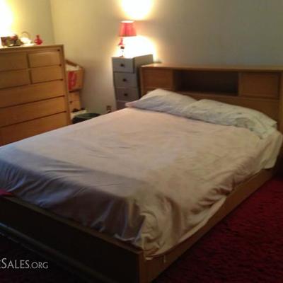 Full-size platform bed with bookcase headboard