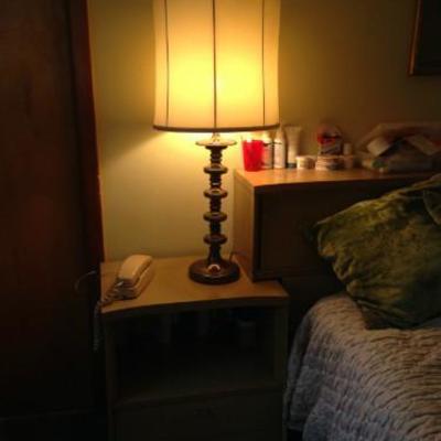 One of a pair of matching nightstands and lamps
