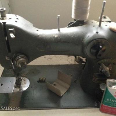 Vintage Singer sewing machine built into desk