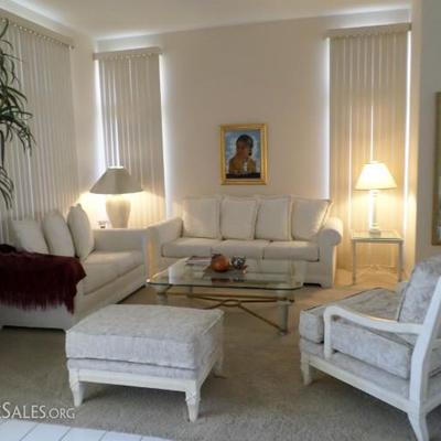 White couch, loveseat, oversize chair with ottoman