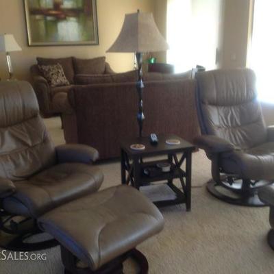 Pair of leather recliners, ottomans, tables, lamps