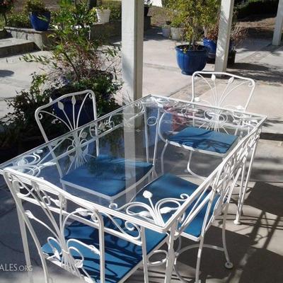 Wrought iron patio table & 4 chairs