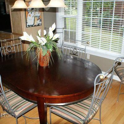 Beautiful Wood Table with Metal Trim and 6 Charleston Forge Iron Chairs