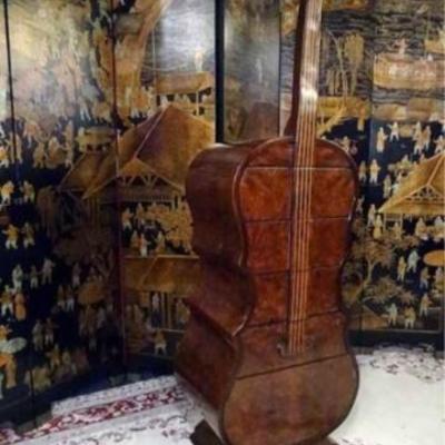 Carved wood chest in form of a cello