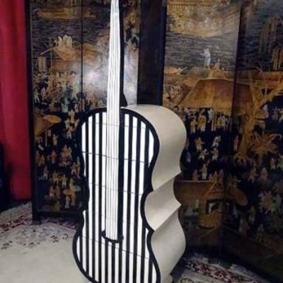 White and black wood chest in form of a cello